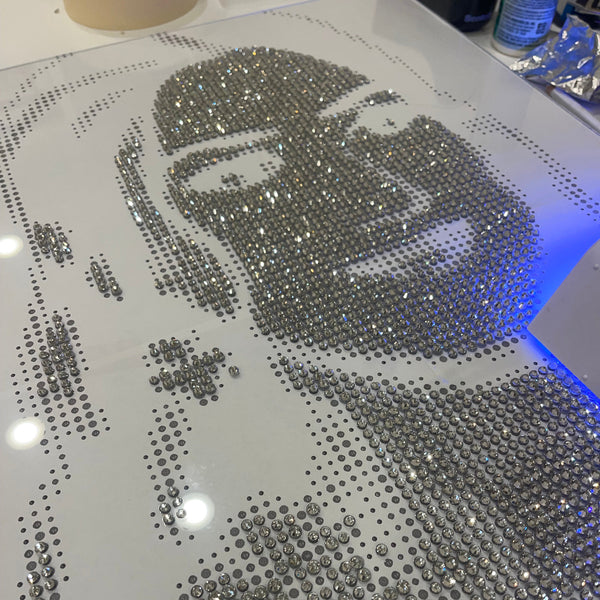 Handmade rhinestone portrait with intricate detailing and shimmering effect