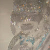 Handmade rhinestone portrait with intricate detailing and shimmering effect