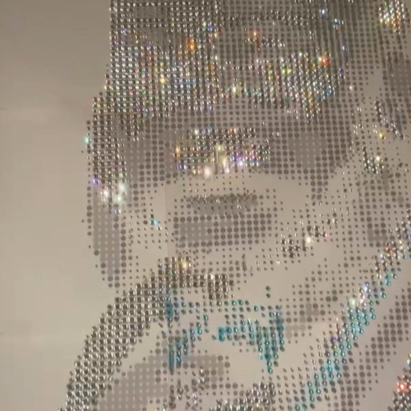 Handmade rhinestone portrait with intricate detailing and shimmering effect