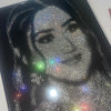 Close-up of a sparkling rhinestone portrait showcasing delicate craftsmanship