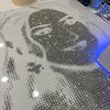 Handmade rhinestone portrait with intricate detailing and shimmering effect