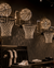 A retail store interior featuring multiple basketball-themed wall-mounted chandeliers made of clear crystals or glass, each with a hoop and a matching crystal ball. Basketballs are visible on shelves, and clothing racks with black apparel and white sneakers are below.